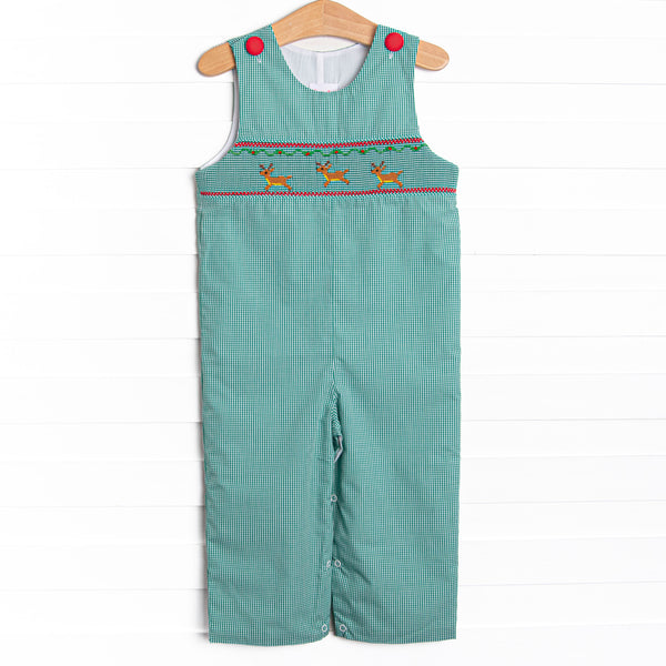 This bubble features a green gingham print, red covered buttons, and a reindeer smockings.