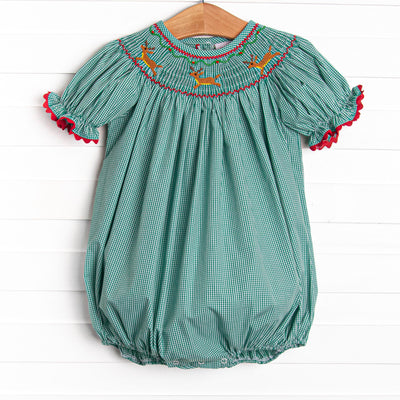  This bubble features a green gingham print, puff sleeves, and a reindeer smockings. 