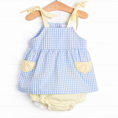  This set features a blue gingham print, yellow seersucker straps, and lemon slice appliques. Coordinating yellow seersucker diaper cover to match. 