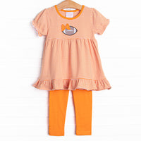  This set features a puff sleeve top in an orange striped print and coordinating orange knit leggings to match. 