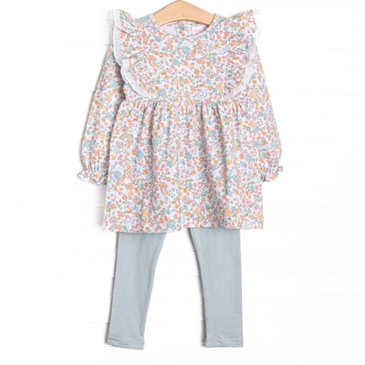 This set features a blue floral print, eyelet lace trim, and blue leggings to match.