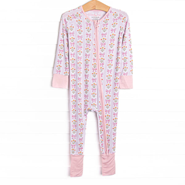 This zippy is made of the extremely soft, stretchy bamboo viscose fabric that feels like butter. With fold over cuffs at the feet so it can be worn as a romper or a zippy, a double zipper for easier diaper changes, and a floral and bow print