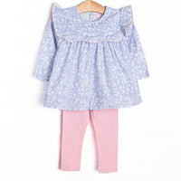  This set features a blue floral print, a ruffle bib with pink trim, and pink leggings to match. 