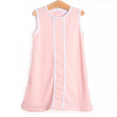 This dress features a pink knit material, white trim, and button closure on the back.