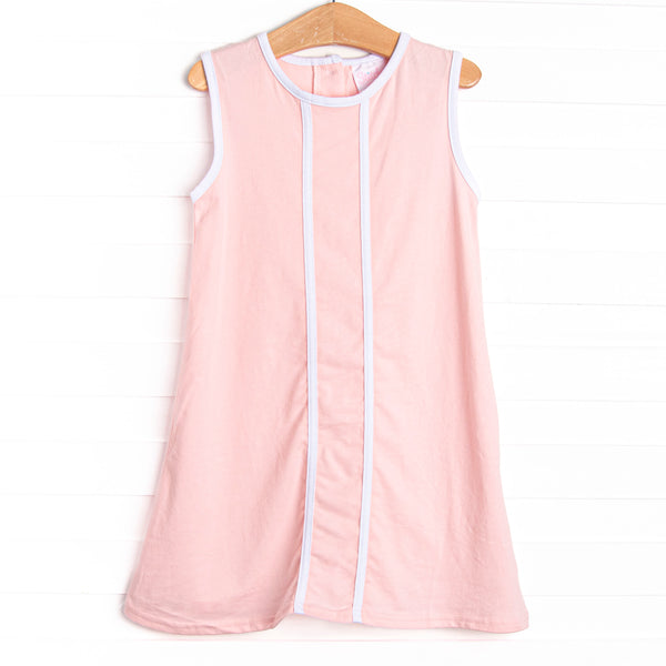 This dress features a pink knit material, white trim, and button closure on the back.