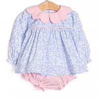  This set features a blue floral print, a pink scalloped collar, and pink piping. Coordinating pink diaper to match. 