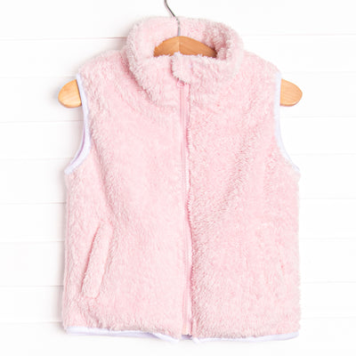  This vest features the softest pink fuzzy fleece, pockets to keep little hands warm, and a full zipper down the front. 