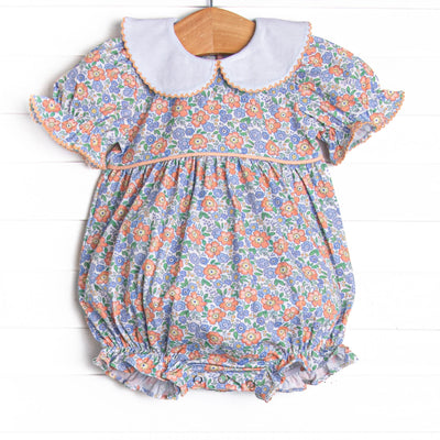 This bubble features a blue floral print, puff sleeves, and a peter pan collar.
