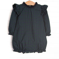 This bubble features navy and green plaid, ruffle trim, and long sleeves.