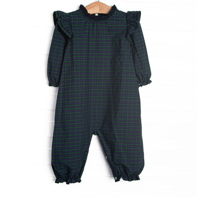 This romper features navy and green plaid, ruffle trim, and long sleeves.