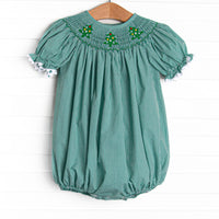 This bubble is perfect for the holiday season! It is featured in green gingham and a trio of embroidered Christmas trees and smocking along the neckline!