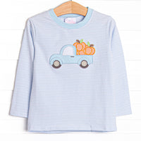 This top features a blue striped print, long sleeves, and a pickup truck pumpkin applique.