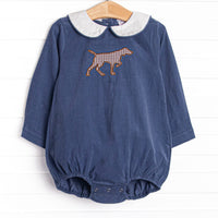 This bubble features a Navy Corduroy material, a peter pan collar, and a puppy applique.
