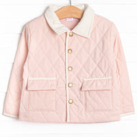  This coat features a pink quilted material, cream collar and trim, and pink&nbsp; gingham lining. 