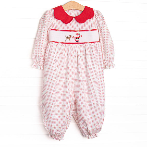  This romper features a red bitty dot print, red scalloped collar, and a santa and his reindeer smocking. 