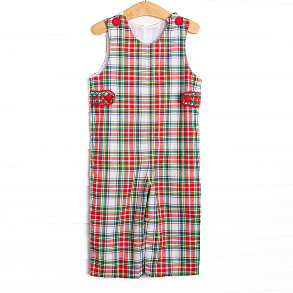  This Jon Jon features a red plaid print, red covered buttons, and smocked tabs on the sides. 