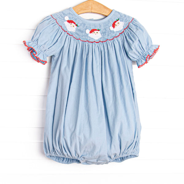 This bubble features a blue corduroy material, puff sleeves with red picot trim, and Santa Claus smockings.