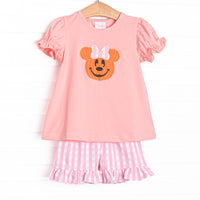This set features pink fabric, a Jack-O-Lantern mouse applique, and light pink windowpane ruffle shorts to match.