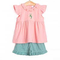 This set features pink fabric, a ruffle collar, and a Tinker Bell embroidery. Coordinating green gingham ruffle shorts to match.