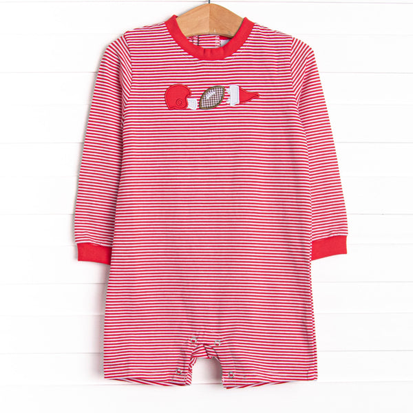  This romper features a red striped print, snaps on the stride, and a football applique. 