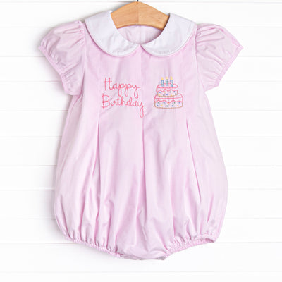 This bubble features a pink mini gingham print, puff sleeves, and a birthday embroidery.