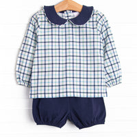 This set features a blue plaid print, a navy blue peter pan collar, and a navy bloomer short to match.