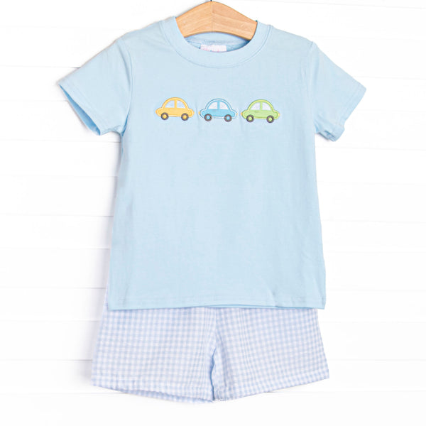 This set&nbsp; features a royal blue short sleeve top with trio of cars smockings and blue gingham shorts to match