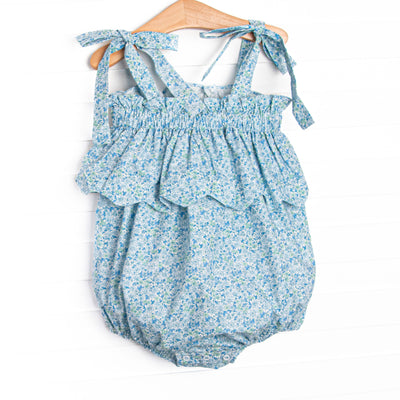 This bubble features a blue floral print, elastic band on top, and scalloped trim