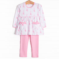 This set features a ballet slipper print, ruffle trim, and pink leggings to match.