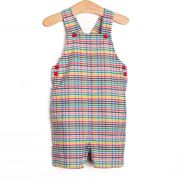 This jon jon features a plaid print, snaps on the stride, and red buttons