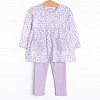  This set features a purple floral print, front pockets, and purple knit leggings to match. 
