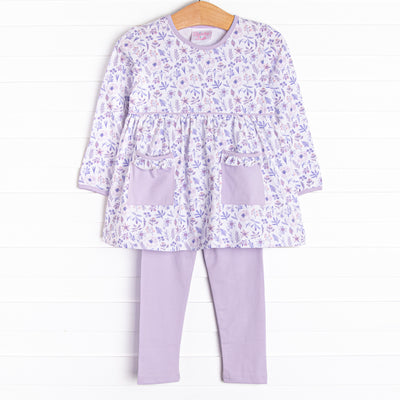  This set features a purple floral print, front pockets, and purple knit leggings to match. 