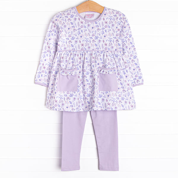  This set features a purple floral print, front pockets, and purple knit leggings to match. 