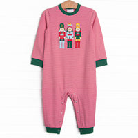  This romper features a red striped print, green trim, and a trio of toy soldiers applique. 