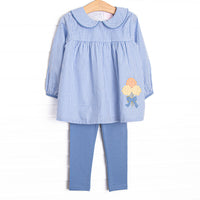 This set features a blue gingham fabric, a blue Peter Pan collar, and a mum applique. Coordinating blue leggings to match.