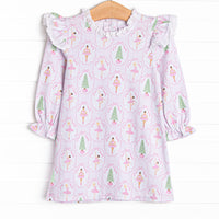 This dress features a holiday print, ruffle shoulders, and eyelet lace trim.