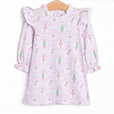 This dress features a holiday print, ruffle shoulders, and eyelet lace trim.