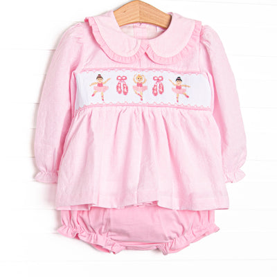 This set features pink mini gingham fabric, ballerina smocking, and a ruffle Peter Pan collar. Coordinated pink diaper cover to match.