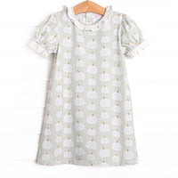 This bubble features a green pumpkin print, a ruffle collar, and puff sleeves.