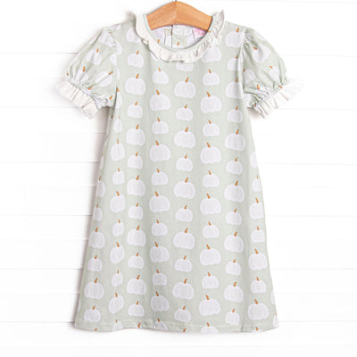 This bubble features a green pumpkin print, a ruffle collar, and puff sleeves.