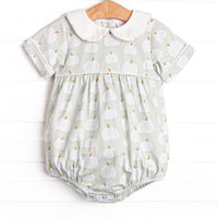 This bubble features a green pumpkin print, a peter pan collar, and snaps on the stride.