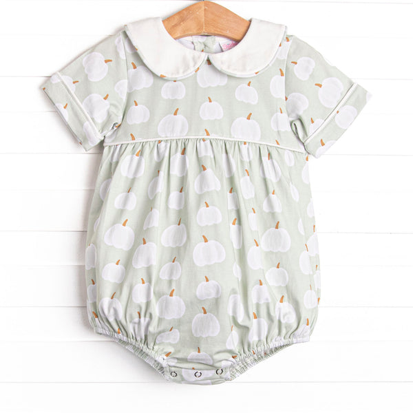This bubble features a green pumpkin print, a peter pan collar, and snaps on the stride.