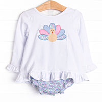 This set features a long sleeve top with a turkey applique and blue floral print diaper cover to match.