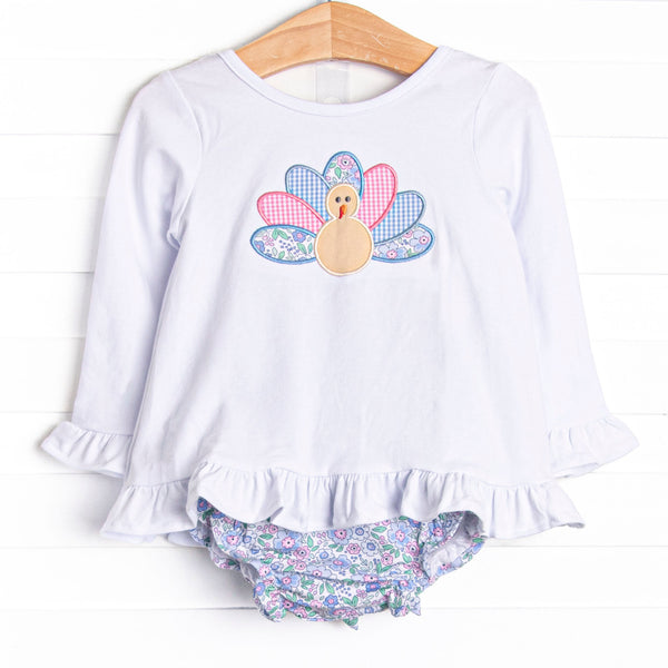 This set features a long sleeve top with a turkey applique and blue floral print diaper cover to match.