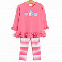 This adorable legging set features a tea set applique, tiered ruffles, and matching pink and white striped leggings.