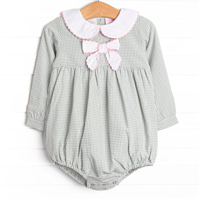  This bubble features a sage gingham print, a bow collar with pink ric rac trim, and snaps on the stride. 