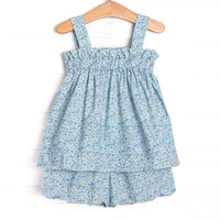 This set features a blue floral print, elastic band on top, and scalloped trim.