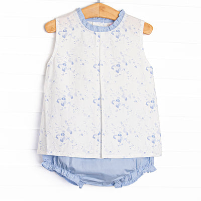  This set features a blue floral print, blue ruffle trim, and&nbsp; blue diaper cover to match. 