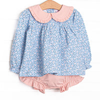 This set features a blue floral print, a pink Peter Pan collar, and long sleeves. Coordinating pink diaper cover to match.