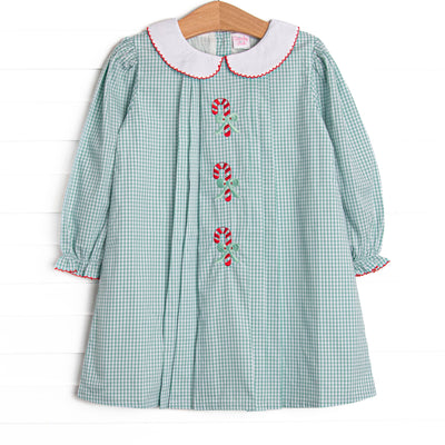 This dress features a sage green gingham, a peter pan collar, and candy cane embroideries.